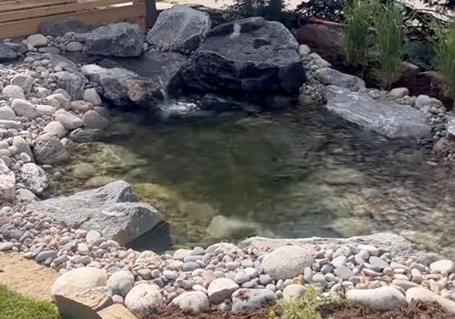 water-feature-fence-black-rock
